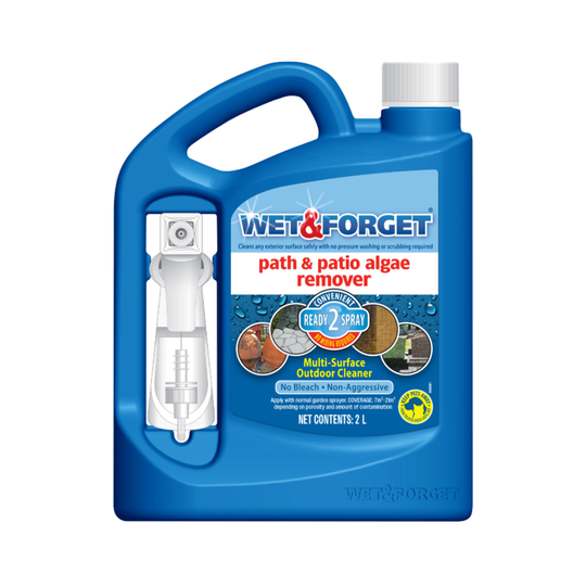 A 2-Litre blue plastic bottle of Wet & Forget Path & Patio Algae Remover with a white spray nozzle applicator attached.